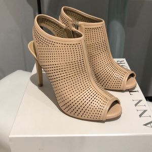Nude pink peep toe booties with cut out detailing